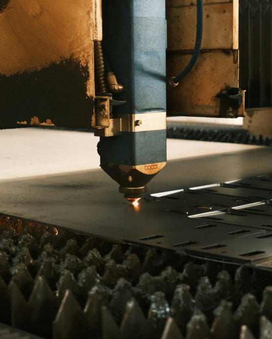 a-machine-cutting-a-piece-of-metal-in-a-factory.jpg A machine cutting a piece of metal in a factory