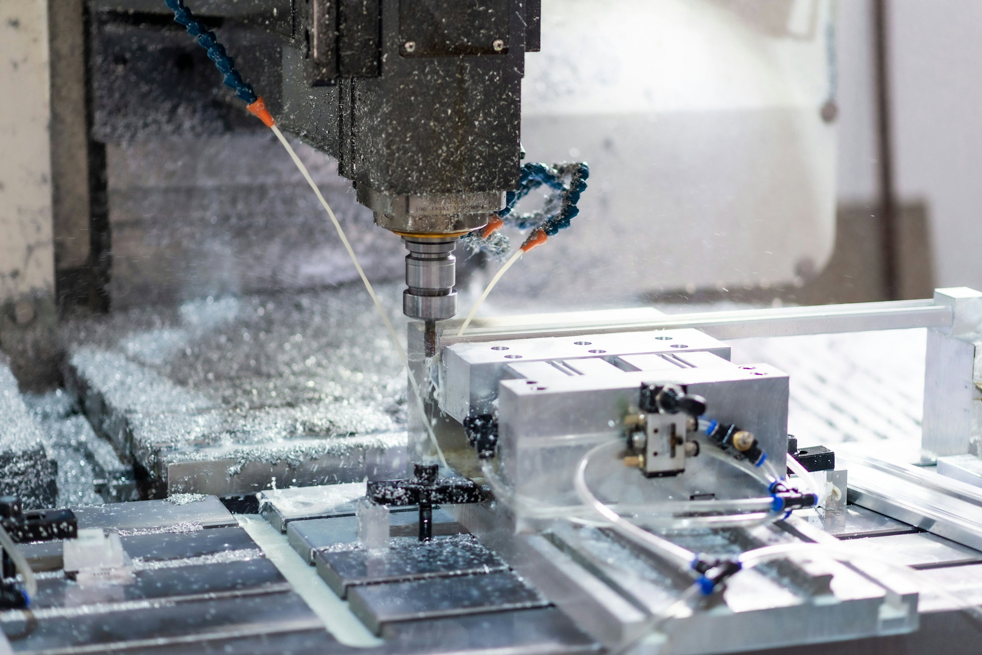 a-machine-that-is-cutting-a-piece-of-metal.jpg A machine that is cutting a piece of metal